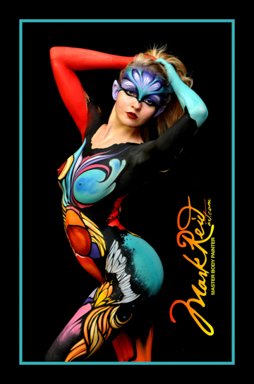 Blonde woman in red, yellow and blue body and face paint.